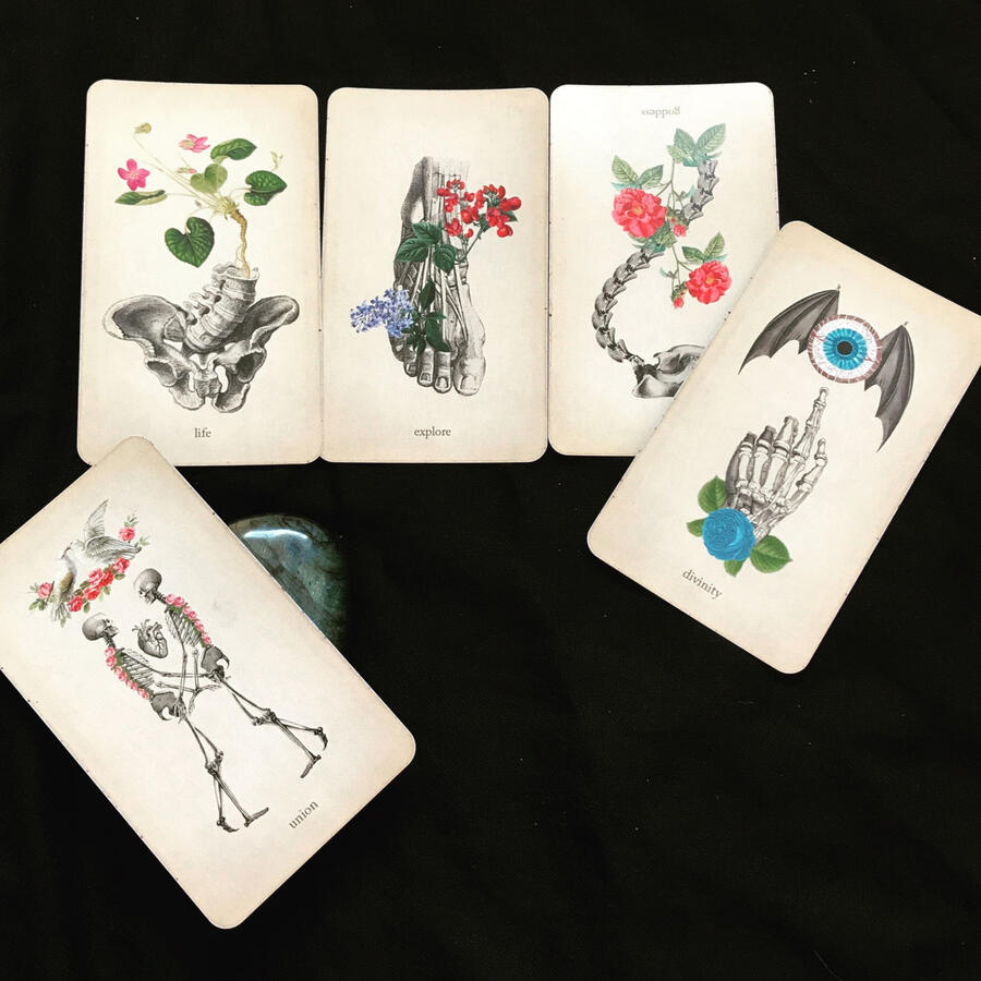 image of a 5 card oracle spread on a plain black background